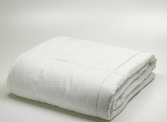 folded light white duvet/quilt isolated on white