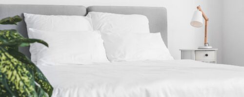 Big comfortable bed with clean linen in room Big comfortable bed with clean linen in room