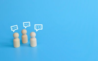Wooden doll figures of people with notification icons of message and chatting social media interactions